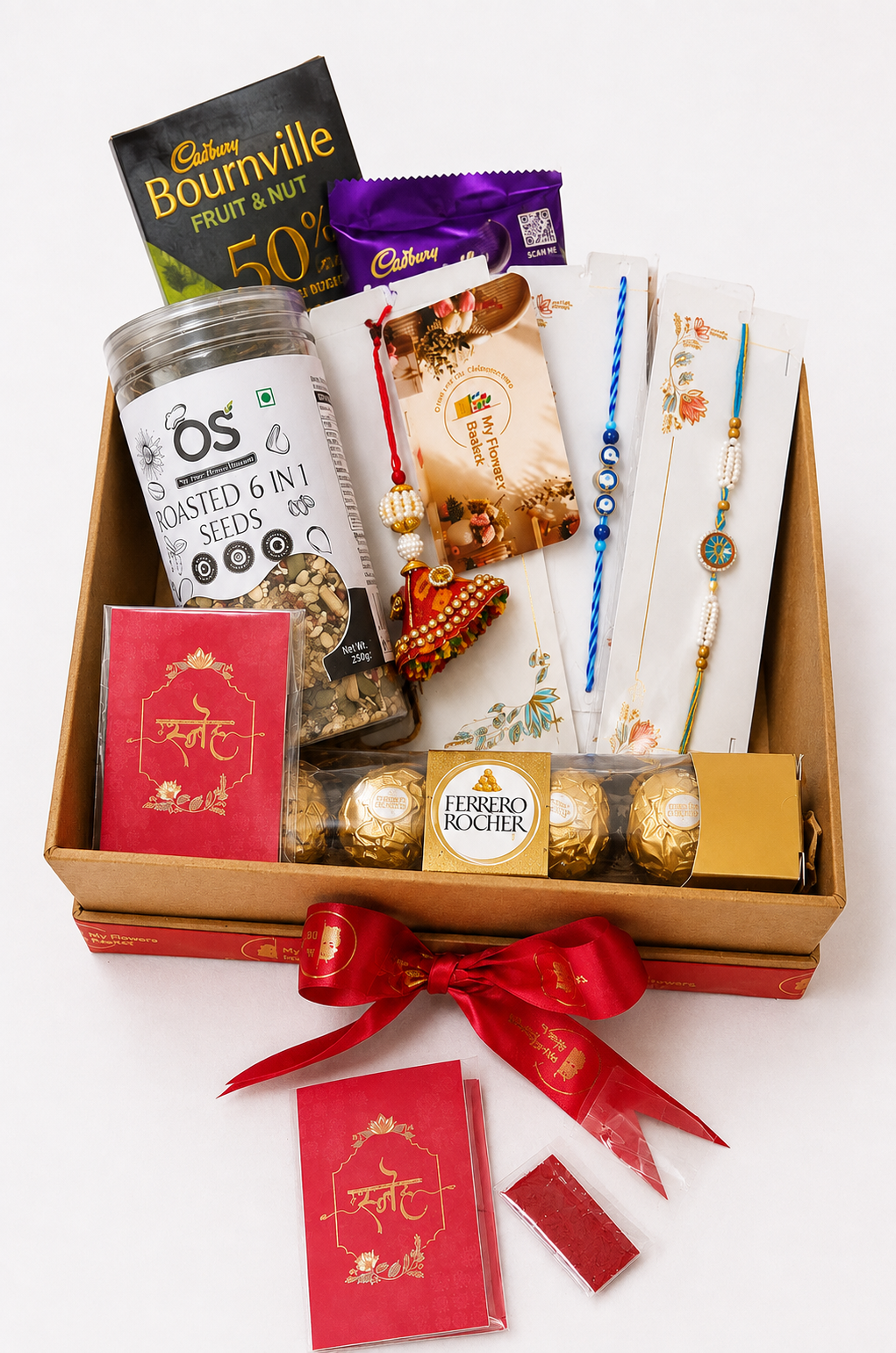 Premium Rakhi Gift Hamper for Brother with Ferrero Rocher chocolates, Cadbury chocolates, roasted seeds, designer rakhis and festive gift box