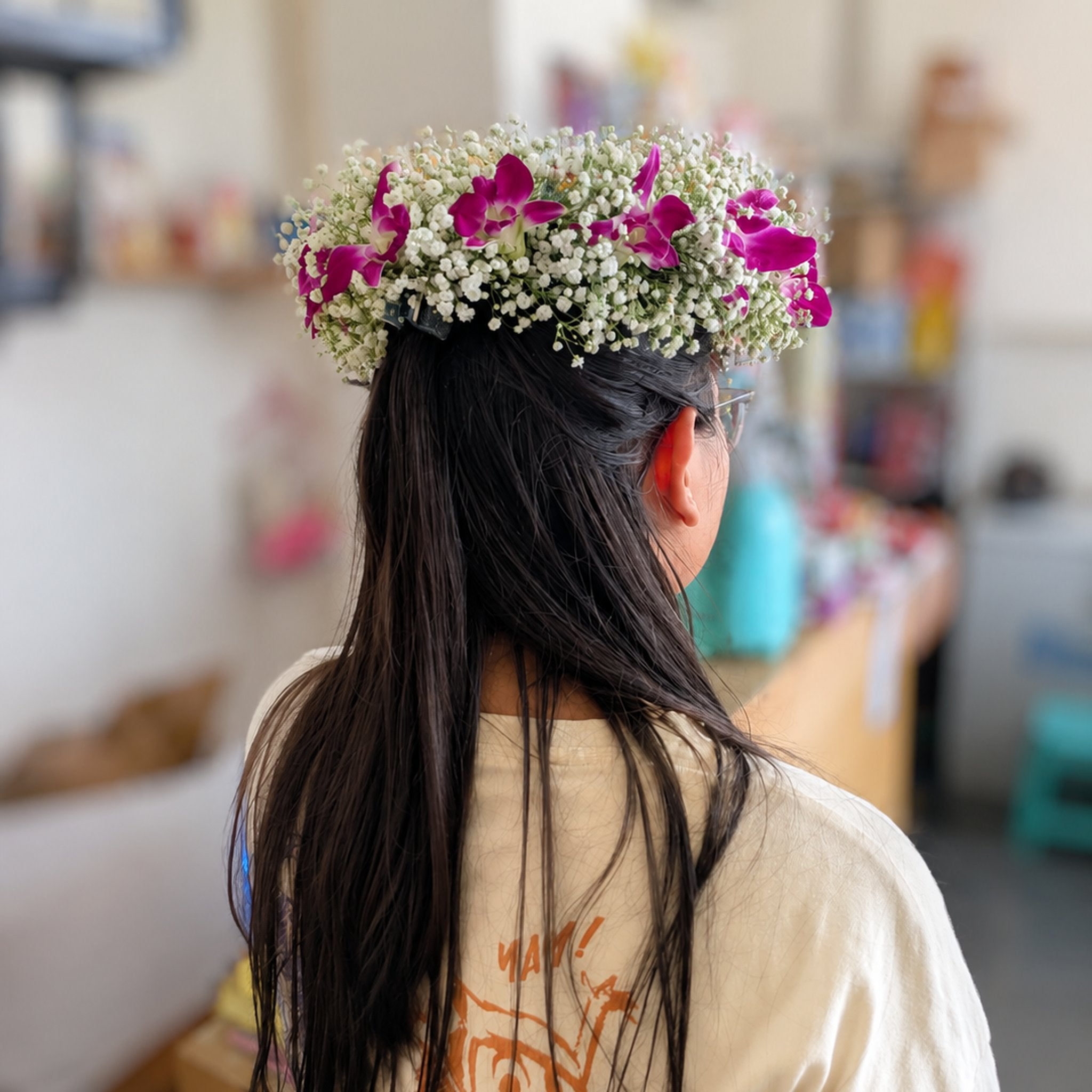 Pink floral tiara with orchids and baby's breath for weddings and special occasions